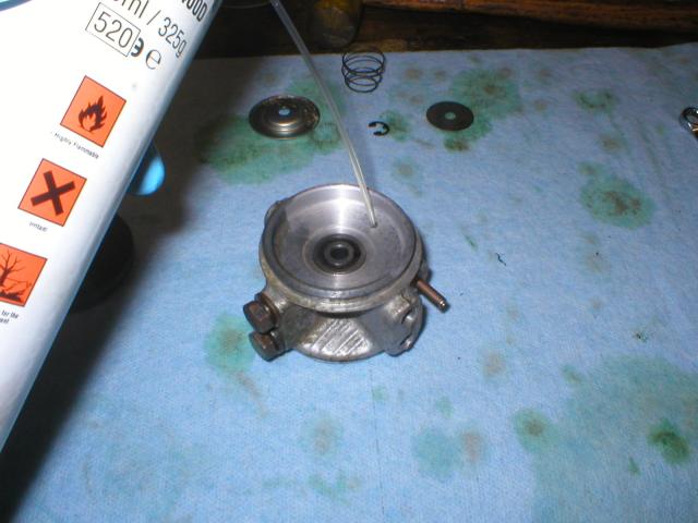 Spraying solvent into the damper exit hole