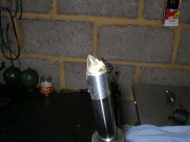 taping the top of the piston